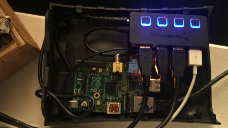 Raspberry pi and Sabrent USB hub in a plastic hard drive enclosure